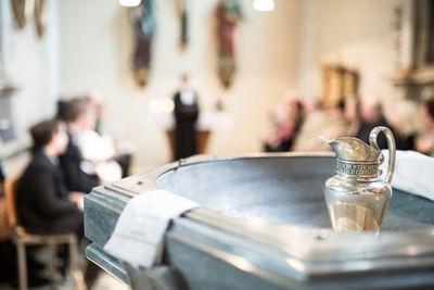 Close-up of jug in church