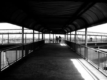 People walking on footbridge