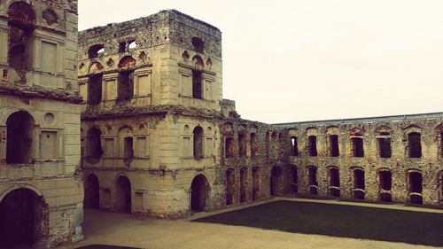 Low angle view of old building against sky