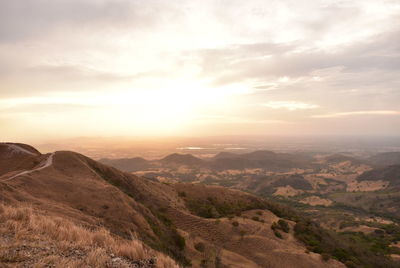 Scenic view of landscape against sky during sunset