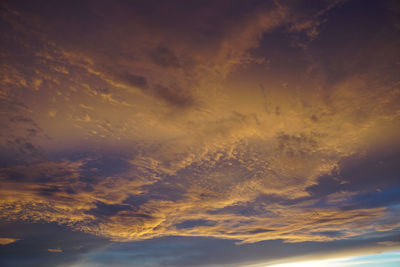 Low angle view of dramatic sky during sunset