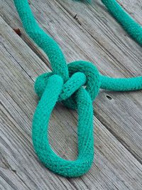 High angle view of blue rope on pier