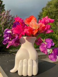 Close-up of pink roses in vase on table