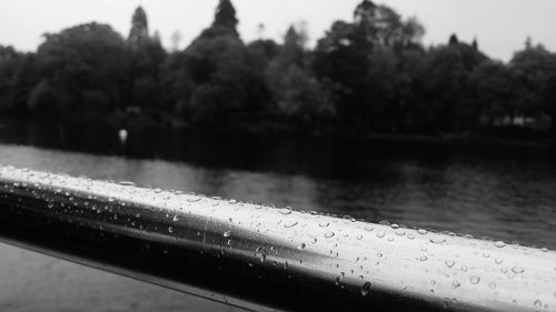 Close-up of calm lake against blurred background