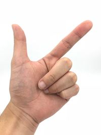 Close-up of human hand against white background