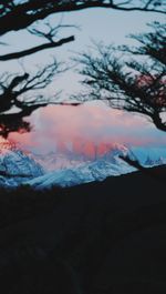 Scenic view of snowcapped mountains against sky during winter