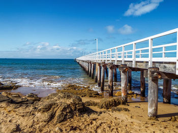 Pier over sea against sky