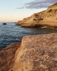 Scenic view of sea against sky at sunset