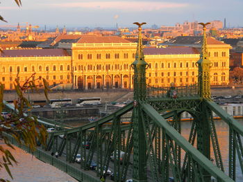 Bridge over canal against buildings in city