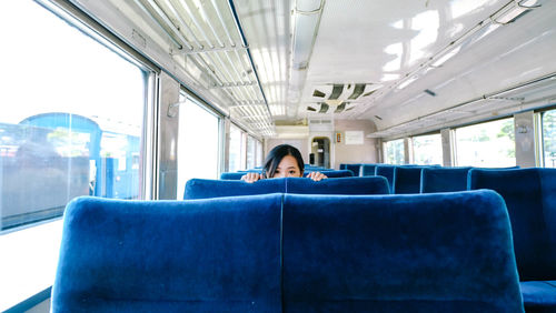 Woman sitting in bus