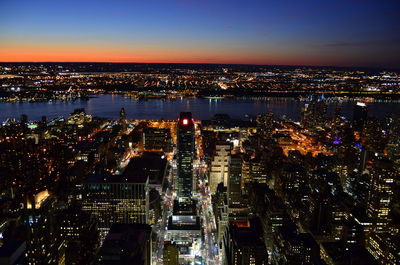 Aerial view of illuminated cityscape at night