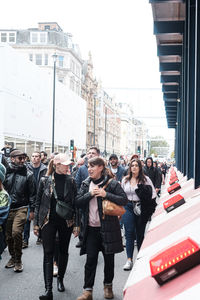 People standing on street in city