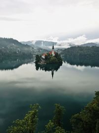 High angle view of church amidst lake