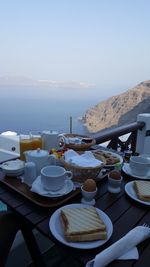 High angle view of table by sea against sky