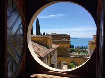 Panoramic view of sea seen through window