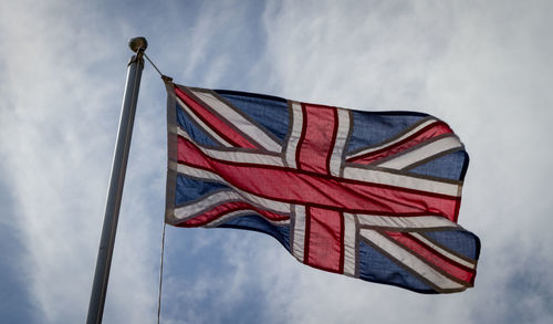 Low angle view of flag against sky