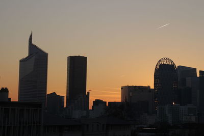 Silhouette of city at sunset