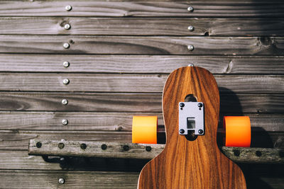 High angle view of skateboard hanging on rack