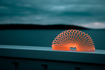 Close-up of illuminated orange sea against sky