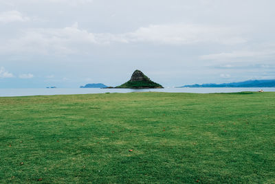 Scenic view of sea against cloudy sky