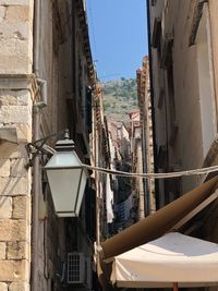 Buildings in town against clear sky