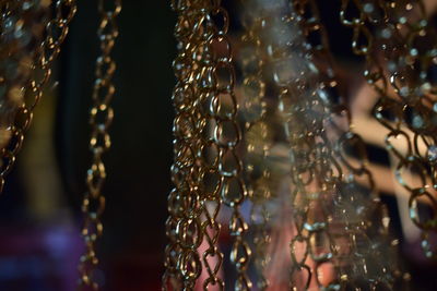 Close-up of chain hanging on metal