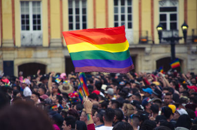 Group of people in front of flags