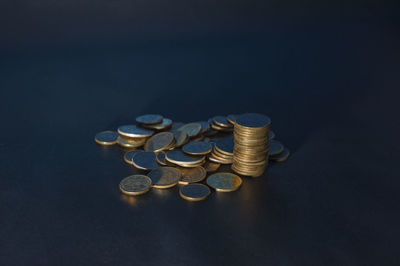 Stack of coins on black background