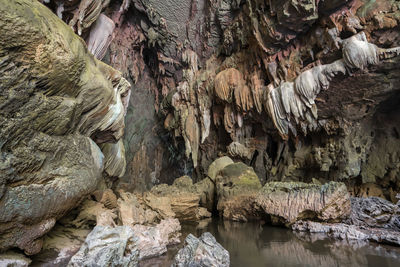 Low angle view of rocks in water