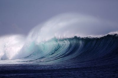 View of waves breaking at sea