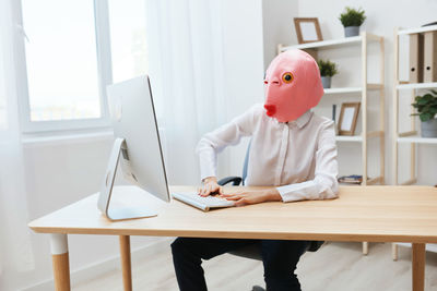 Young woman using laptop at home