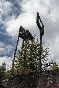 Low angle view of old abandoned building against sky