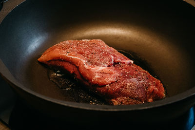 High angle view of meat in cooking pan