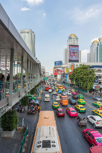 High angle view of traffic on road amidst buildings in city