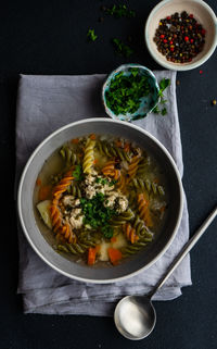 Directly above shot of pasta soup in bowl on table