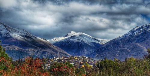 Scenic view of snowcapped mountains against sky