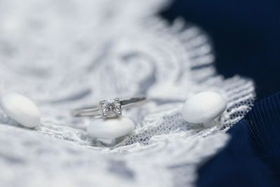 Close-up of wedding rings on snow