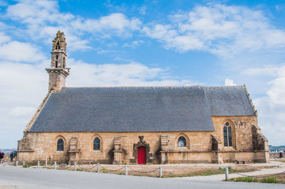 Exterior of historic building against sky