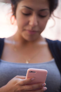 Close-up of woman using mobile phone