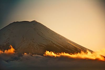 Scenic view of mountains against sky during sunset