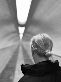 Headshot of a woman walking in a tunnel