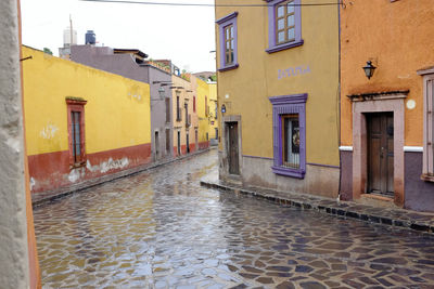 Alley amidst buildings in city