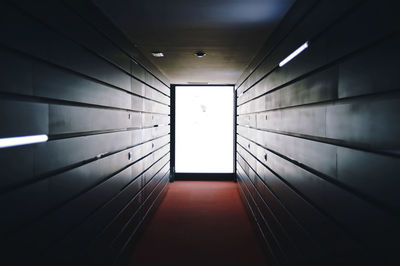 Directly below shot of illuminated corridor of building