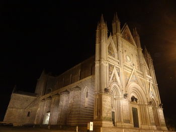 Low angle view of illuminated temple against sky at night