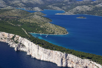 High angle view of sailboats on sea shore