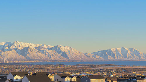 Scenic view of mountains against clear blue sky