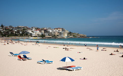 Panoramic view of beach against blue sky