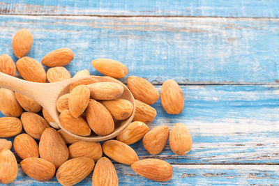 High angle view of pumpkins on table against blue background