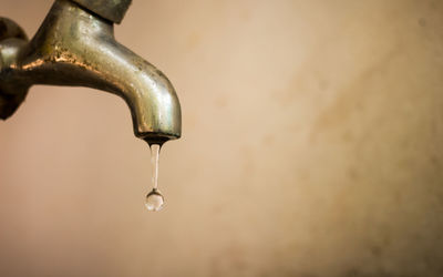 Close-up of water falling from faucet