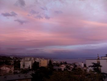 Cityscape against dramatic sky